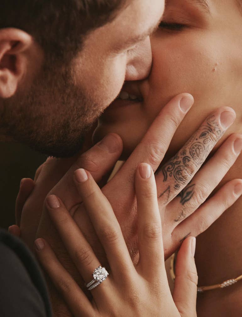 Couple embracing adorned in TACORI Jewelry
