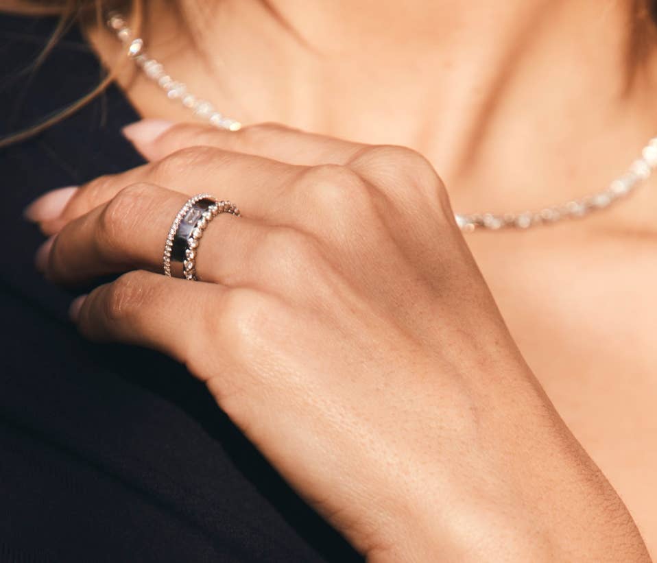 Close up of woman's hand with ring stack