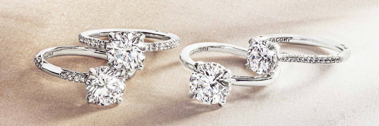 Engagement rings on light brown grain background